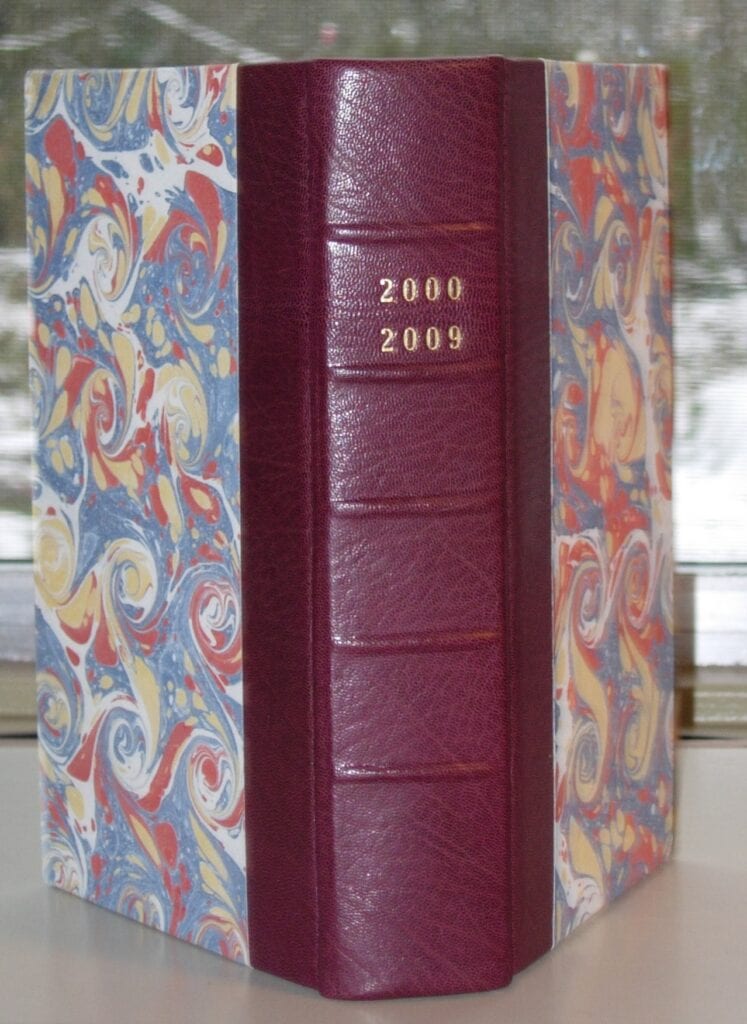 A red book with gold lettering on the cover.