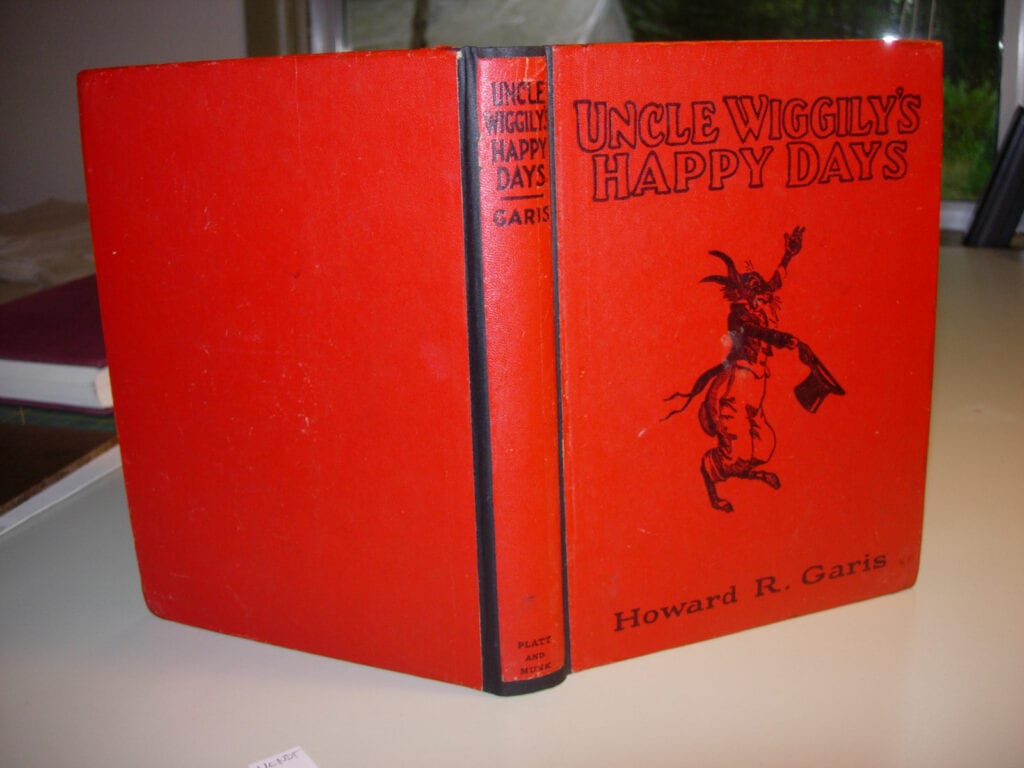 A red book with an image of a cowboy on it.